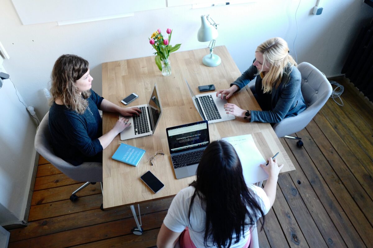 women meeting website redesign